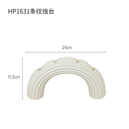 Elegant white ceramic candlestick holder with curved ribbed design and four holes for dining room decorbites elegant white decor