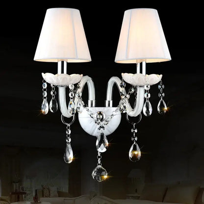 Elegant white crystal wall lamp with two fabric shades and dangling teardrop crystals for bedroom decorbites crystal wall lamp
