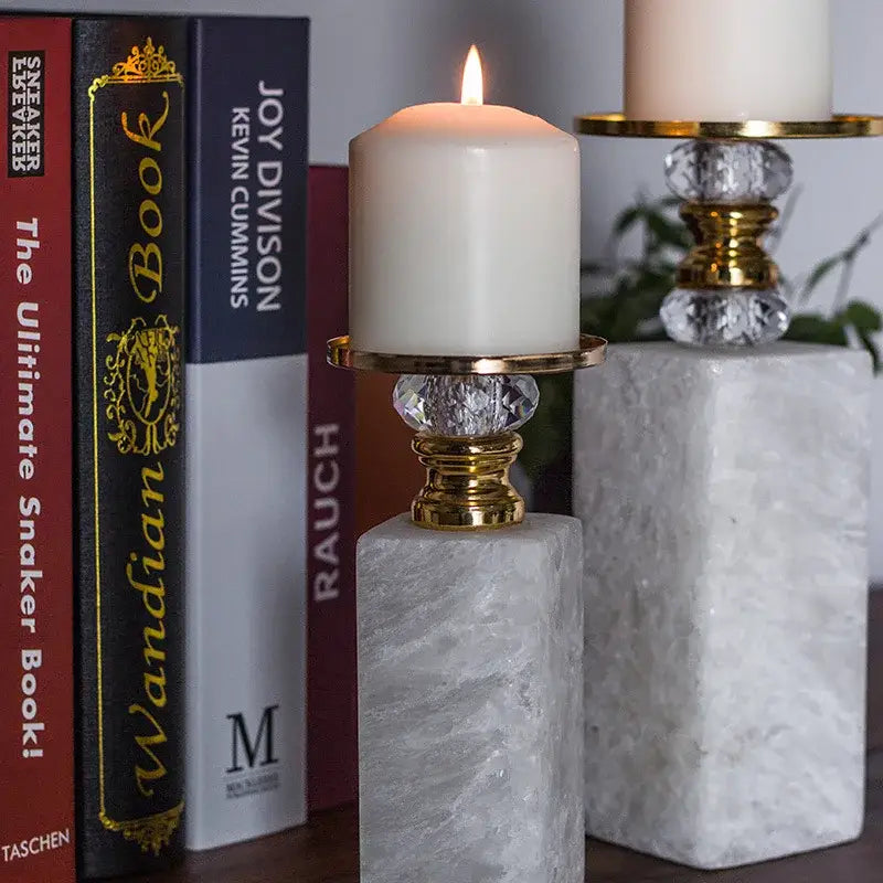 Elegant white candle in a decorbites gold marble candle holder with crystal accents and a marble base for dining room decor