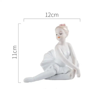 Elegant white porcelain ballet girl figurine seated gracefully with a soft pink flower for bedroom decor