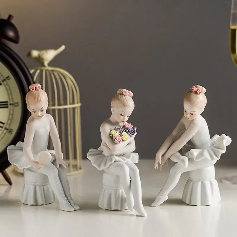 Elegant white porcelain ballet girl figurine set featuring three delicate ballet girl figurines with pink hair buns