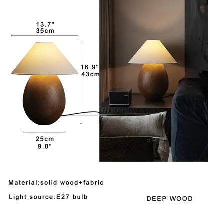 Elegant wood table lamp with warm-toned teardrop wooden base and cream fabric shade by decorbites for bedroom decor