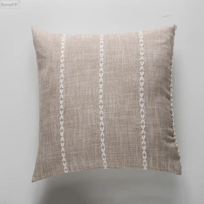 Beige linen throw pillow with cream stitched leaf patterns featuring brown grey stripe embroidery for decorbites living room decor