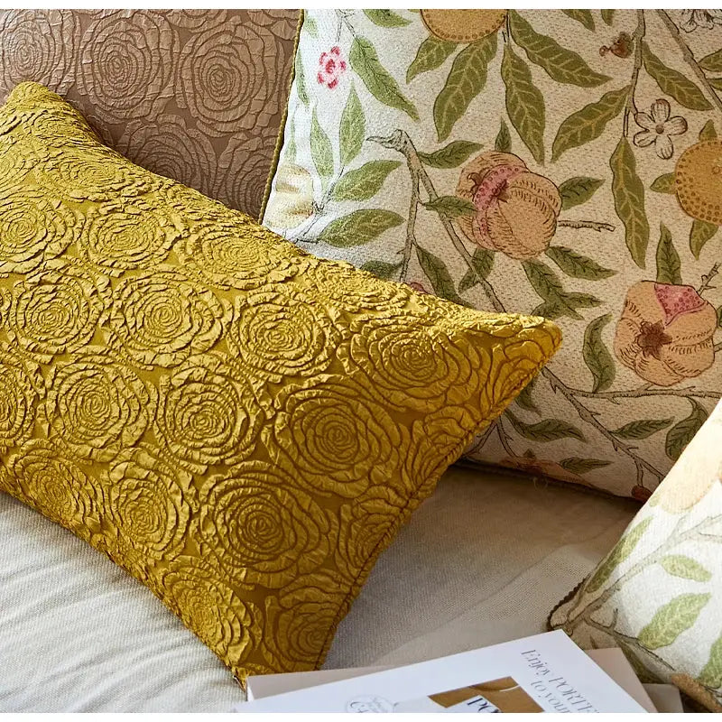 A mustard-yellow pillow case with raised textured embroidered citron flowers plants decorbites for living room decor