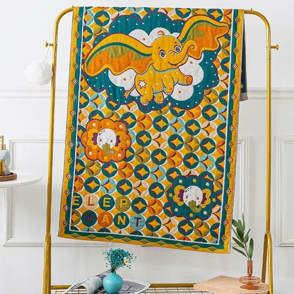 Embroidered cream fruit cotton gauze bath towels featuring a vibrant yellow and teal quilt with a cartoon dumbo elephant decorbites cotton gauze bath
