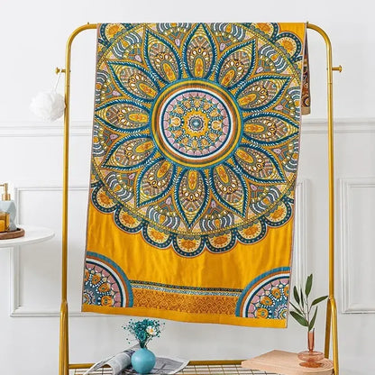 Vibrant yellow mandala tapestry with intricate teal gold and pink patterns hanging on a golden rack decorbites cotton gauze bath towels bathroom decor