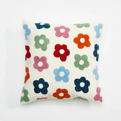 A cream-colored embroidered daisy dandelion cushion cover with colorful textured floral patterns for living room decor