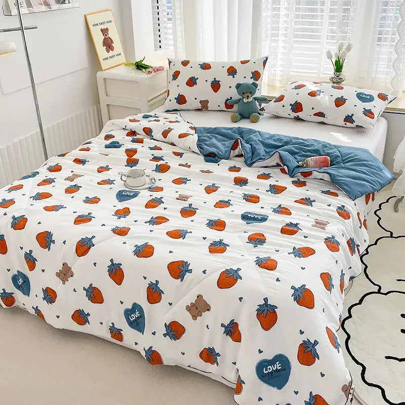 Embroidered double gauze rabbit print quilt featuring a white strawberry-themed duvet with orange strawberries and blue hearts