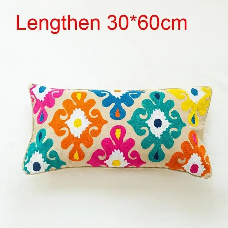 Vibrant flower boho long cushion cover with embroidered floral patterns in pink orange teal and yellow on beige fabric