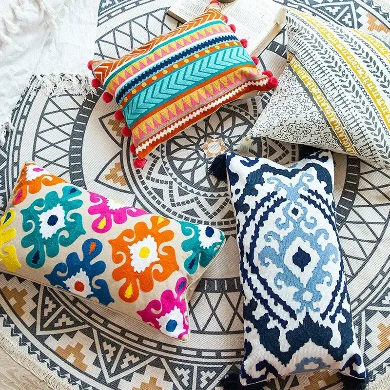 Vibrant embroidered flower boho long cushion covers with colorful geometric and floral patterns on textured fabric