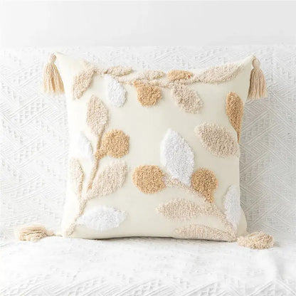 Cream-colored pillow cover with embroidered geometric leaves and tassels for living room tasseled decor
