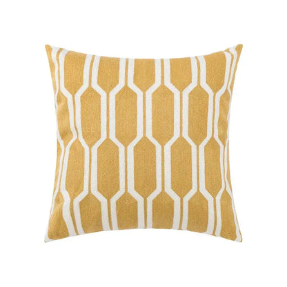 Embroidered green and gold fish pillow cover with mustard yellow floral geometric woven fabric for living room decor