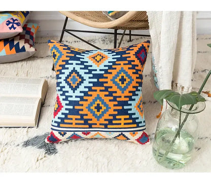 Vibrant embroidered kilim style cushion cover with navy orange light blue and red geometric pattern for living room