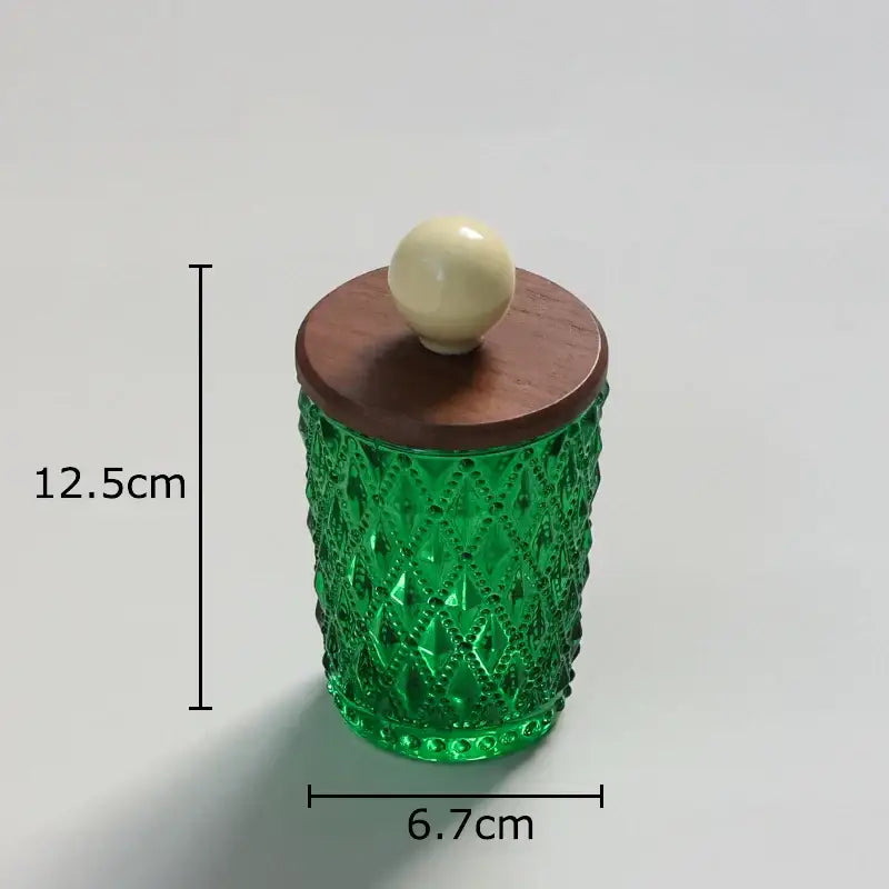 Emerald green diamond glass storage jar with textured pattern and walnut lid featuring decorbites ceramic ball knob