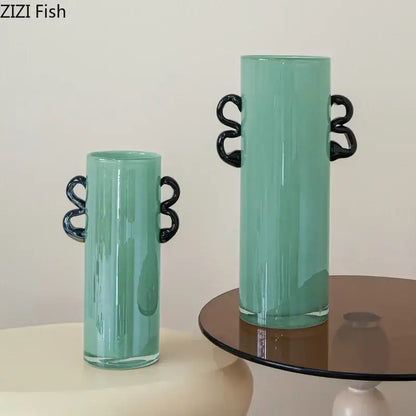 Emerald green glass vase with black twisted handle accents suitable for living room decor display
