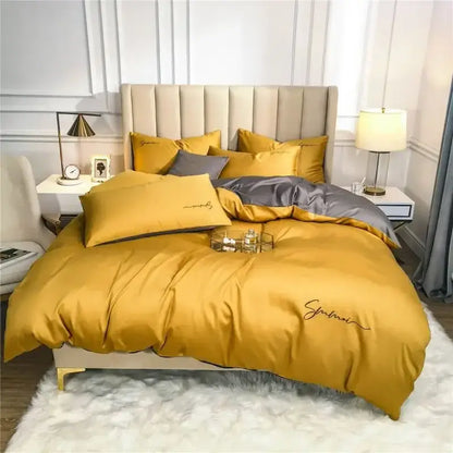 Emerald green and pink egyptian cotton bedding set featuring golden satin duvet cover with embroidered script and gray accent pillows