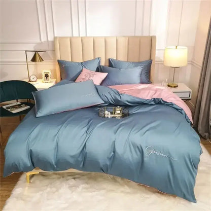 Emerald green and pink egyptian cotton bedding set with blue satin duvet cover and pink embroidered script detailing