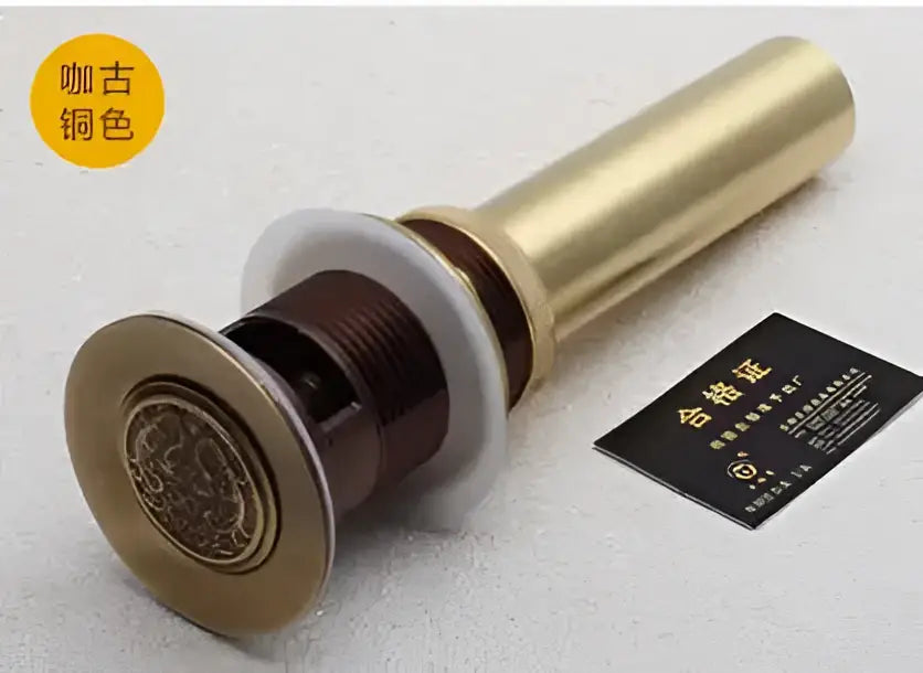 Engraved brass bathroom sink pop up drain stopper with a decorative circular plate for decorbites brass bathroom decor
