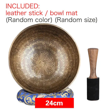 A 24cm engraved gold bronze tibetan singing bowl with sanskrit script and mandala design with wooden mallet for meditation