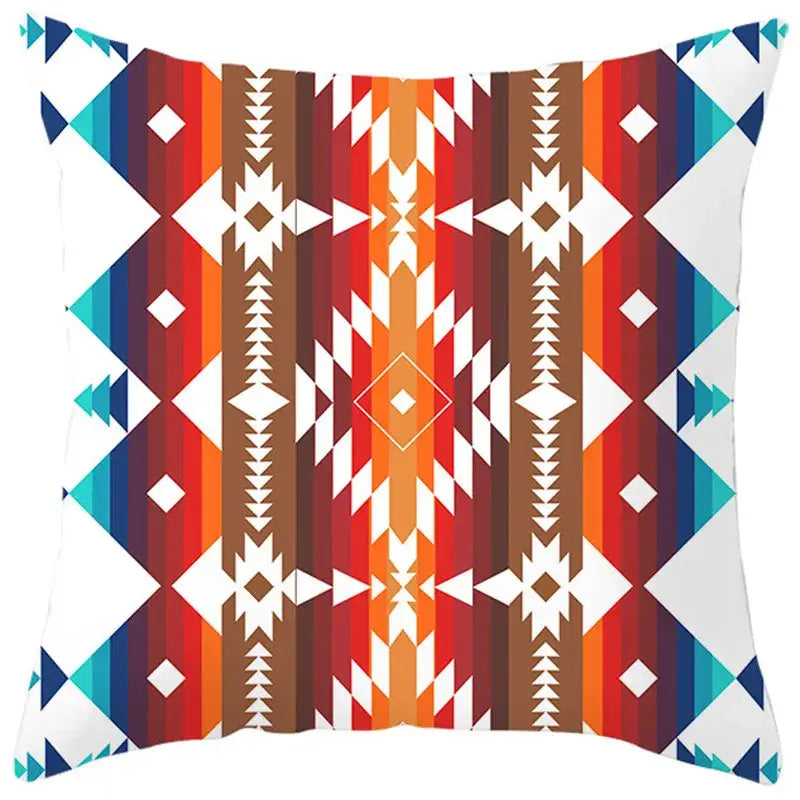 Ethnic bohemian geometric pillow cover with vibrant red orange brown and teal stripes featuring white diamond shapes decorbites