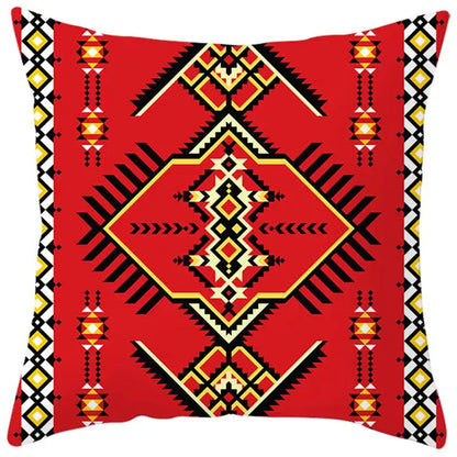 Vibrant red pillow cover with bold black yellow and cream ethnic bohemian geometric patterns for living room decorbites decor