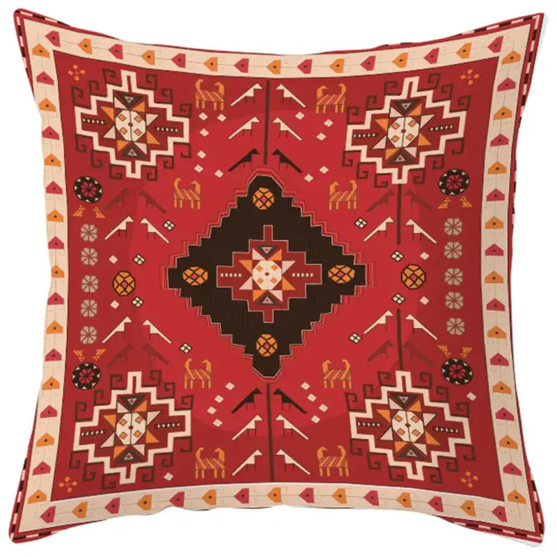 Red ethnic bohemian geometric pillow cover with cream black orange and brown motifs on textured fabric decorbites decor