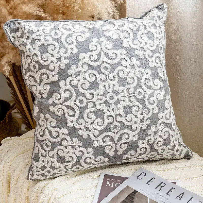 Gray cushion cover with intricate white embroidered swirl ethnic pattern for decorbites ethnic pattern cushion decor