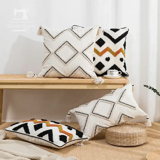 White cushion cover with ethnic style black and orange geometric patterns and tassels for living room decorbites ethnic style