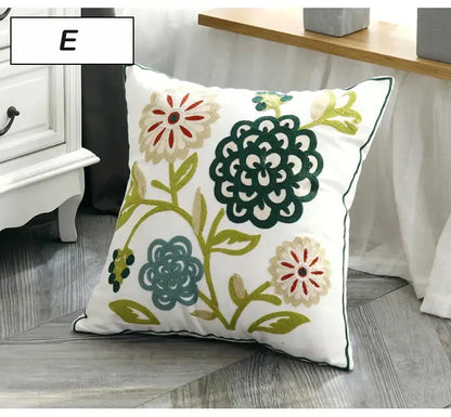 White pillow cover with intricate green teal and beige floral embroidery with red centers ethnic style canvas decorbites
