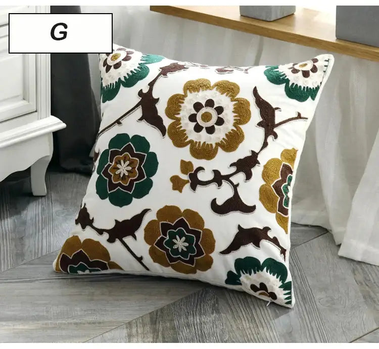 White ethnic style canvas pillow cover with embroidered green brown and gold floral and bird motifs for decorbites decor