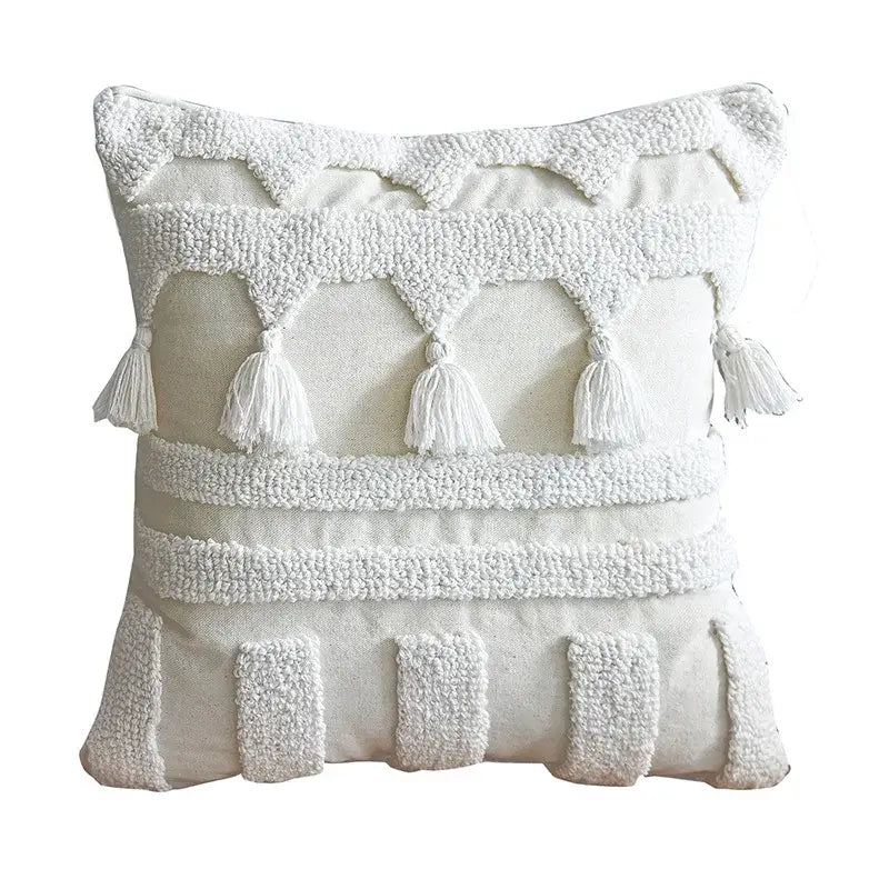 Ethnic tufted cushion case cream and white throw pillow with tassels and layered embroidered patterns by decorbites