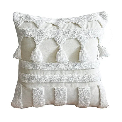 Ethnic tufted cushion case cream and white throw pillow with tassels and layered embroidered patterns by decorbites