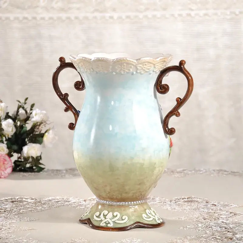 Delicate european floral elephant vase in white and pink ceramic with ornate handles and intricate detailing for decorbites decor