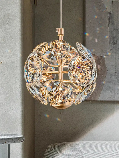 European gold and polished chrome mini pendant light with faceted spherical glass in a symmetrical orb design for dining room