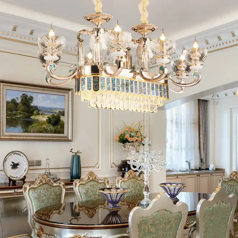 European gold and teal crystal dining room chandelier with ornate arms and blue-tinted glass panels for decorbites crystal dining