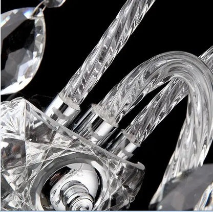 European gold crystal wall lamp with clear faceted glass arms and polished chrome fittings for bedroom candle sconce