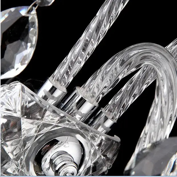 European gold crystal wall lamp with clear faceted glass arms and polished chrome fittings for bedroom candle sconce