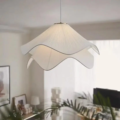 A white paper fabric petal pendant light with delicate petal design by decorbites for dining room decor