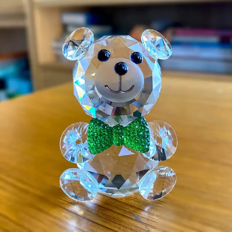 Faceted clear crystal teddy bear figurine with green rhinestone bow tie and black bead eyes for bedroom decor