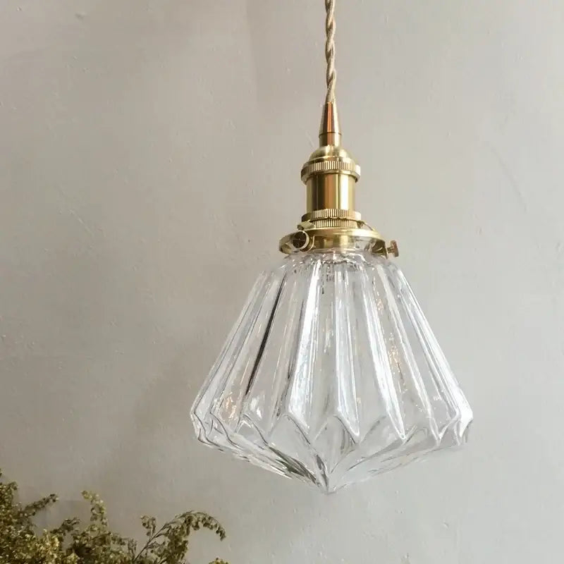 Clear faceted glass pleats led pendant light with brass fixture and twisted cord for dining room lighting