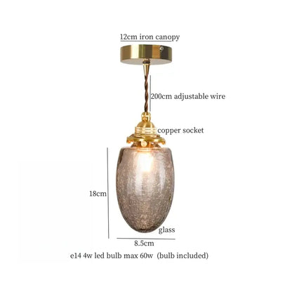 Faceted glass pleats led pendant light with amber textured shade and brass finish ideal for dining room lighting