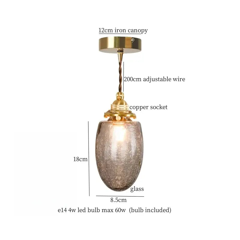 Faceted glass pleats led pendant light with amber textured shade and brass finish ideal for dining room lighting