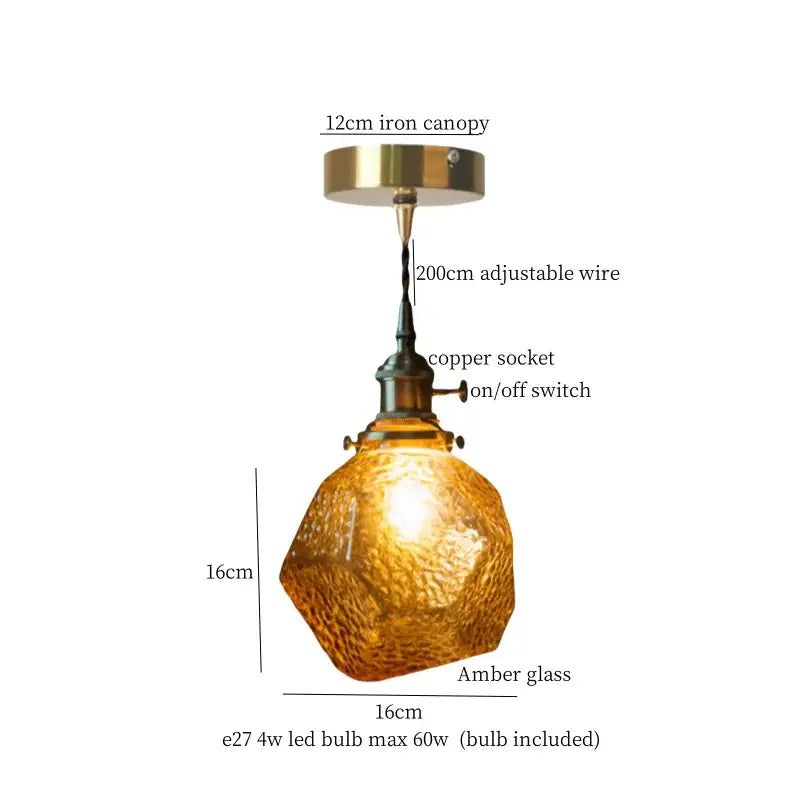 A warm amber faceted glass pleats led pendant light with brass hardware for dining room pendant lights