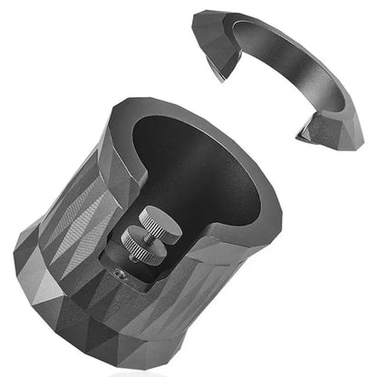 Faceted matte black metal espresso portafilter holder with textured interior and adjustable screw mechanism for secure use