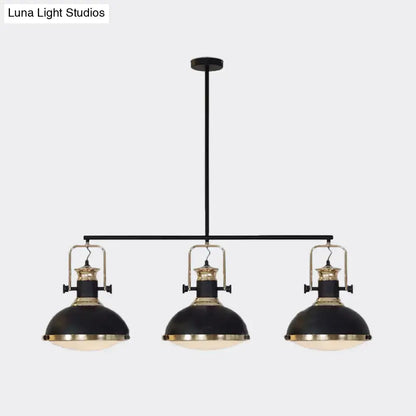 DecorBites™ farmhouse three-light island pendant with black metal dome shades and brass accents for dining room down lighting