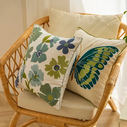 Cream-colored pillow cover with embroidered green blue floral and butterfly designs for decorbites decorative farmhouse throw