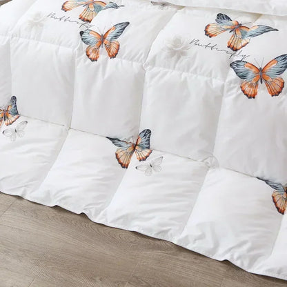 White goose down quilt with vibrant orange and blue butterfly print on white quilted comforter for winter bedding