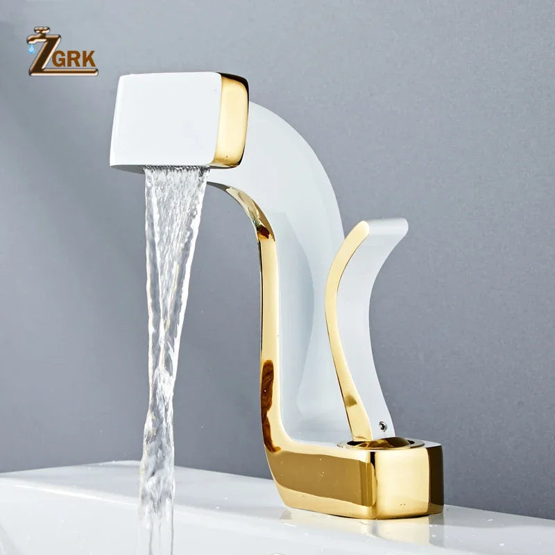 A sleek single hole bathroom faucet with white ceramic housing material and polished gold waterfall spout design