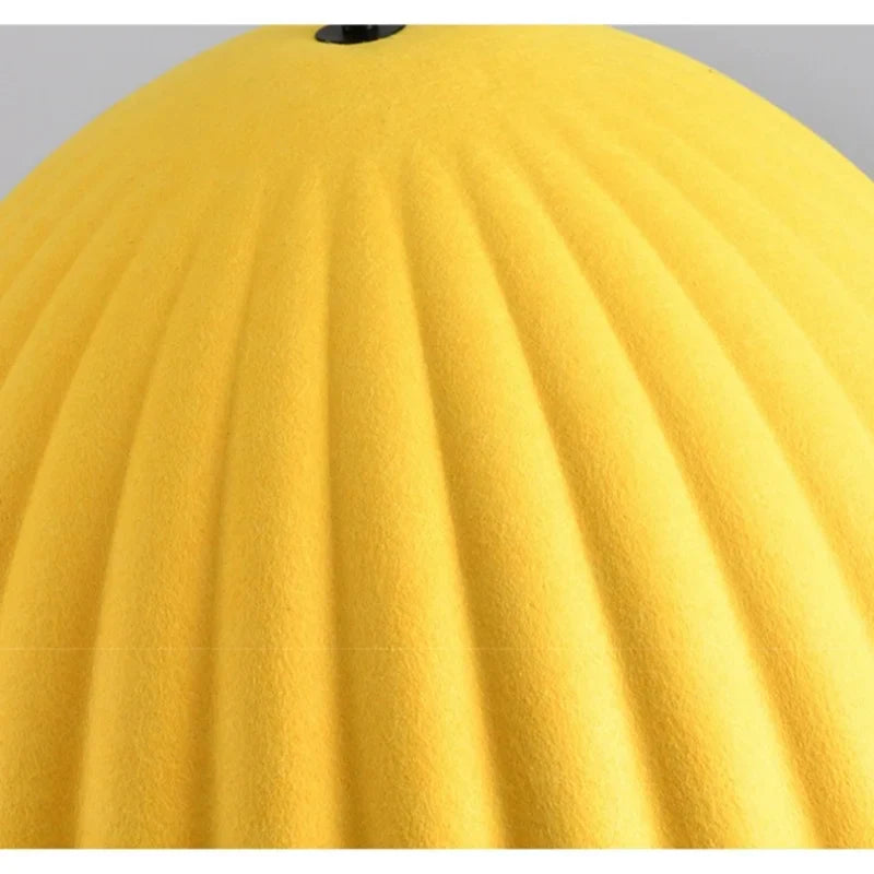 Bright yellow ribbed felt pendant light acoustic with a matte finish designed for office use