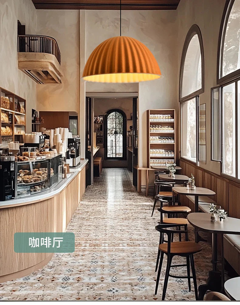 Warm orange ribbed felt pendant light acoustic hangs from the ceiling for office use